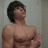 A shirtless muscular man with dark hair stands in a room with light-colored walls, while pink pixelated text reads "SAVE A SKATEBOARD" and "RIDE A SKATER" on white backgrounds.