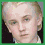 Four distinct pixelated portraits arranged in a , with one stylized emblem on the bottom right
