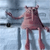 A pixelated figure with elongated limbs and a rounded head stands against a light blue background, arms outstretched in a static pose.