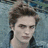 A pixelated image of a person with tousled hair against a blue background, with red text blocks reading "Dazzling Since 1901" and "Twilight New Moon Eclipse Breaking Dawn" on black and gray sections.