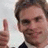 A static image with a red background, blue text, and a person giving a thumbs-up gesture.