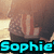 Pixelated image of a person with light brown hair and a dark top, with the name 'Sophie' in bright cyan text at the bottom.