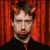 A split-frame contact sheet showing a pixelated image of a person with red devil horns on the left and green text reading "Original Icons .com" on the right, both in low-resolution 8-bit style.