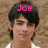 Two side-by-side pixelated portraits of a person with dark hair and white clothing, each labeled with pink text above the head.