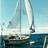 Pixelated static image of a sailboat with two white sails on blue water under light blue sky, showing partial hull and mast details.