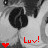 Pixelated grayscale image of a character with dark hair and light clothing, featuring red text 'Luv!' and a red heart symbol.