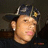 A pixelated image of a person wearing a dark cap with a yellow emblem, positioned next to a red background with blue text reading "R.I.P. Joey luv & mis u".
