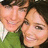 Two people in close proximity on the left, green background with text on the right.