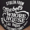 A collage of five showing a person in a black t-shirt with 'Stolen From Mabel's Whore House Las Vegas' text, with one displaying 'WHAT WAS THE ADDRESS?' in pixelated text