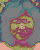 Two animated frames of a pixelated cartoon character with shifting colors and facial features against a gray background.