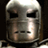 A static buddy icon featuring a metallic Iron Man helmet above golden text reading "IRON MAN" on a black background.