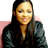 Static 48x48 pixel icon of a person with long dark hair wearing a black jacket over a light-colored top, set against a pink and white background.