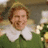 A static image shows a person in a green outfit with a white collar on a red background, with green text reading "i like smiling=) its my fav".