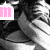 A black-and-white image of a person's face with pink text elements changing across frames, showing 'm', 'e', 'l', '<3', and 'mel<3'.