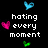Pixelated icon with black background, white text phrases, and colored heart symbols in blue, pink, green.