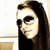 A woman with long dark hair and sunglasses appears in three showing slight head movement against a light background