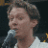 A 48x48 pixel animated contact sheet showing two frames of a Clay Aiken-themed buddy icon with green text on the right and a microphone-wielding figure on the left.