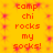 Yellow background with red pixelated text reading 'camp chi rocks my socks!' repeated in two vertical , surrounded by pink starburst patterns