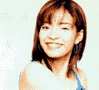 A woman with shoulder-length brown hair wears a blue sleeveless top and blue earrings, shown in three distinct poses against a light background.