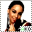 A pixelated image of a person with dark hair in braids, wearing a dark top with red and white accents, positioned against a white background with a green and black text overlay.