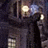 Pixelated static image of a dark urban night scene with multiple glowing streetlights and indistinct building silhouettes.