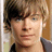 Pixelated image of a person with light brown hair and blue eyes, next to pixelated text reading 'sexyness!!' on white background.