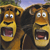 Two cartoon lions with open mouths and wide eyes, one with blue eyes and the other with green eyes, set against a blurred background.