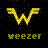 Pixelated yellow 'W' logo with wings above the word 'weezer' in pixelated text on a black background with scattered colored pixels.