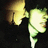 Animated sequence of a person with short dark hair and light skin, wearing a white shirt under a black jacket, against a solid black background.