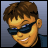Pixelated image of a male face with brown hair, dark sunglasses, and a slight smile against a gradient background.