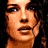 A pixelated image of a woman with brown hair in three distinct poses showing different facial expressions and angles.