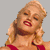 Static pixelated image of a woman with blonde hair in red lingerie against gray background
