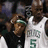 Two pixelated figures in sports attire, one wearing a white jersey with green text and number 5, the other in dark clothing.