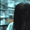 A sequence of showing a figure with long black hair gradually revealing a pale face and eye against a blurred background
