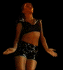 A woman in a black crop top and shorts performs a sequence of arm movements against a solid black background.