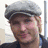 Two side-by-side pixelated images of a person wearing a gray flat cap and light blue jacket, with orange text reading TEAM CARLISLE on black background.