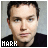 Two side-by-side pixelated images of a person with short dark hair wearing a black shirt, one featuring a pink checkmark symbol in the bottom right corner.