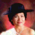 A woman in a black hat and white top appears in three showing head movement from left to right against a red background