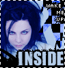 Pixelated image of a person with blue hair and light eyes, featuring text elements 'WAKE ME UP' and 'INSIDE' in blocky lettering.