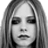 Static grayscale pixel art of a person's face with long hair, featuring dark eye makeup and neutral expression on a white background.