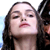 Pixelated close-up of a person with long dark hair and closed eyes against a light background, part of a static single-frame buddy icon.