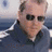 A pixelated image divided into four quadrants with a person in the top-left, text in the top-right and bottom-left, and a gray square in the bottom-right.