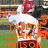 Pixelated image of a person in white shirt and dark shorts holding an orange object, with overlaid orange text reading "TAYLOR" and partial quotes.
