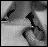 Black-and-white pixelated icon with abstract shapes including a central arrow-like form and curved lines against a gradient background.