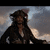 A pixelated image of a character in pirate attire with text overlay reading 'jack sparrow is my hero' against a cloudy sky background.