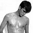Black-and-white pixelated image of a shirtless man with dark hair looking downward, next to green text on a dark background.