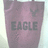 A static image shows a purple tote bag with 'EAGLE' text and an eagle logo, surrounded by pink pixelated text reading 'American', 'Eagle', and 'Outfitter'.