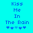 Pixelated text 'Kiss Me In The Rain' in blue on cyan background with two of four heart symbols below