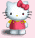 Pixelated Hello Kitty character with red bow, pink dress, and yellow accents on light pink background.