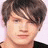 A pixelated image of a person with brown hair on the left, next to blue background text reading 'Cause I've got u to make me feel stronger' with a red heart symbol.